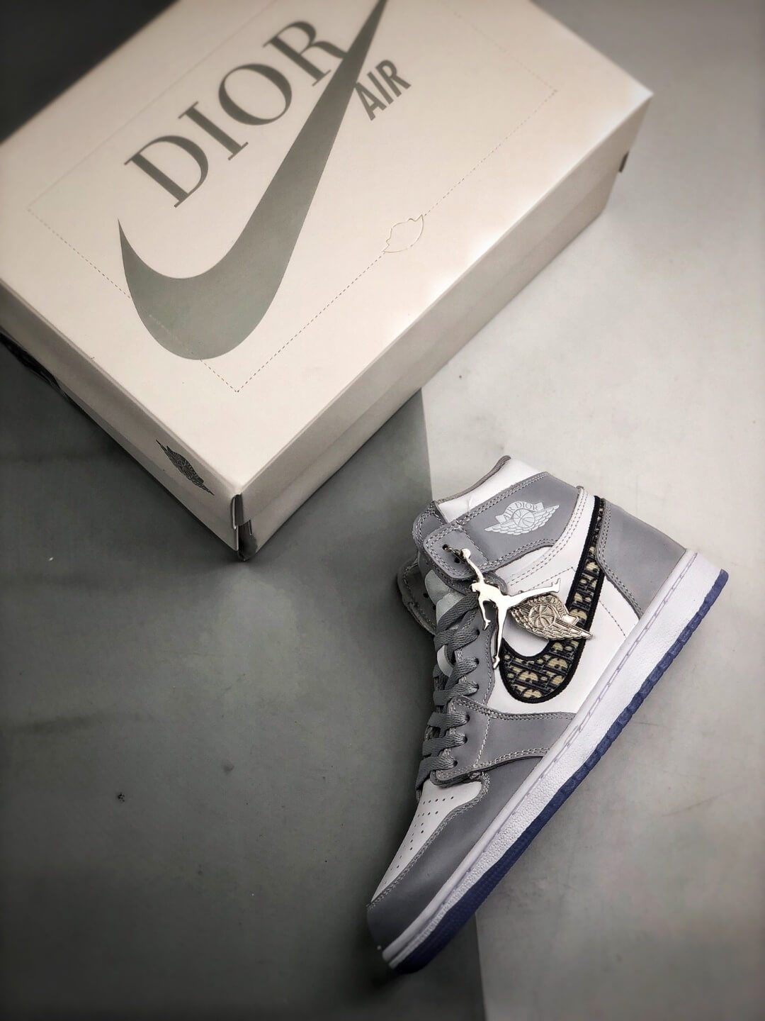 The Nike Dior x Air Jordan High Sneaker White and Grey Upper Top
