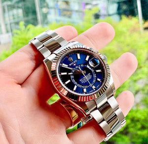 Rolex The Oyster Perpetual Sky-Dweller in White Rolesor with a bright blue dial and an Oyster bracelet. RLX Sky-Dweller RLX-DWELLER